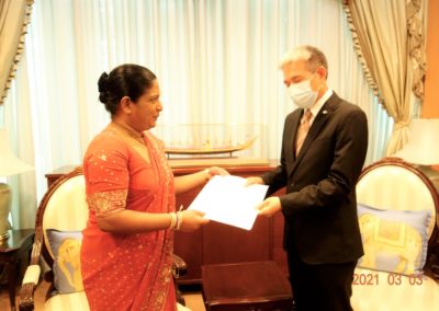 Ambassador (designate) to Thailand C.A. Chaminda I. Colonne presents open copy of the Letter of Credence